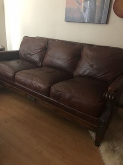 Whitemoore-Sherrill “Limited” highgrain leather sofa with carved wood frame