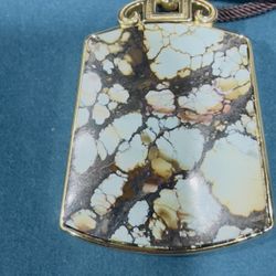Gold plant turquoise pendant