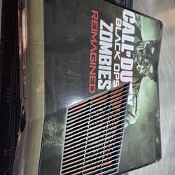 Refurbished xbox 360  bundle with zombie sticker kit.