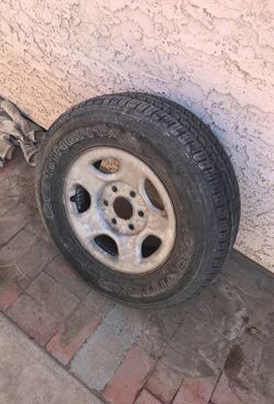 235/70 R16 tire and rim