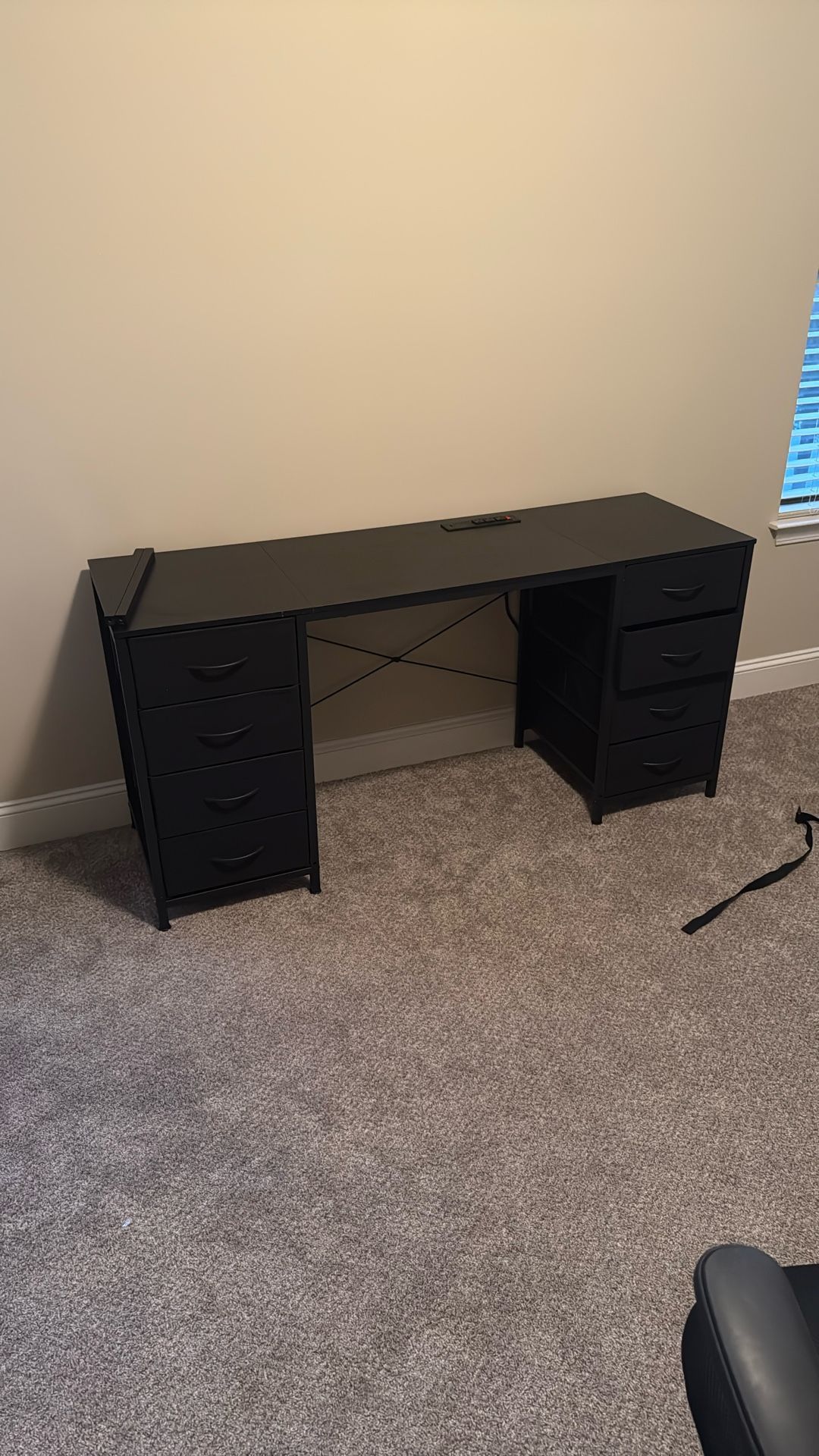 desk with drawer and plugs 