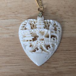 Vintage Carved Heart Shaped Asian Pendant with Monet Chain. 

