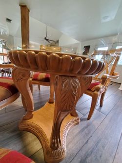 Pedestal dining table, 5' heavy round glass top and 5 big arm chairs