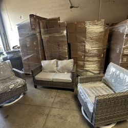 Two single sofas and one loveseat with a small table.