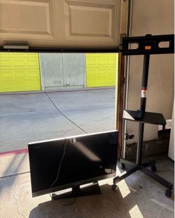 Sony tv with remote and rolling tv stand