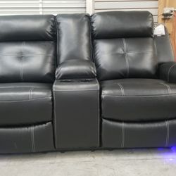Ashley black sofa love with blue floor lighting