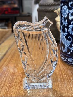 The Waterford Crystal Harp figurine is a beautifully crafted piece made of high-quality crystal. Known for its intricate designs and elegant aesthetic