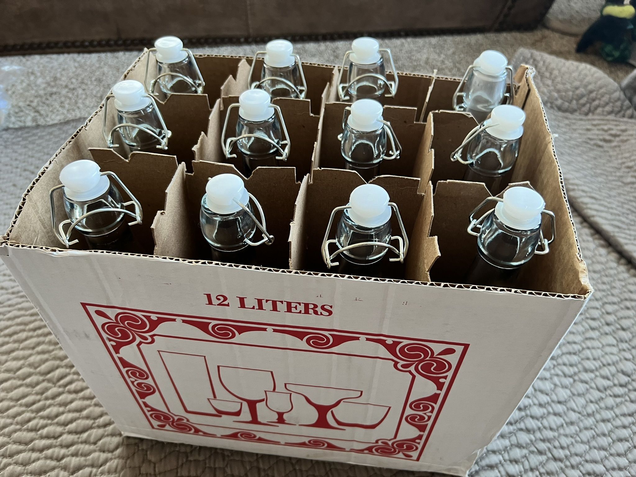12 Glass Bottles with Attached Plastic Caps
