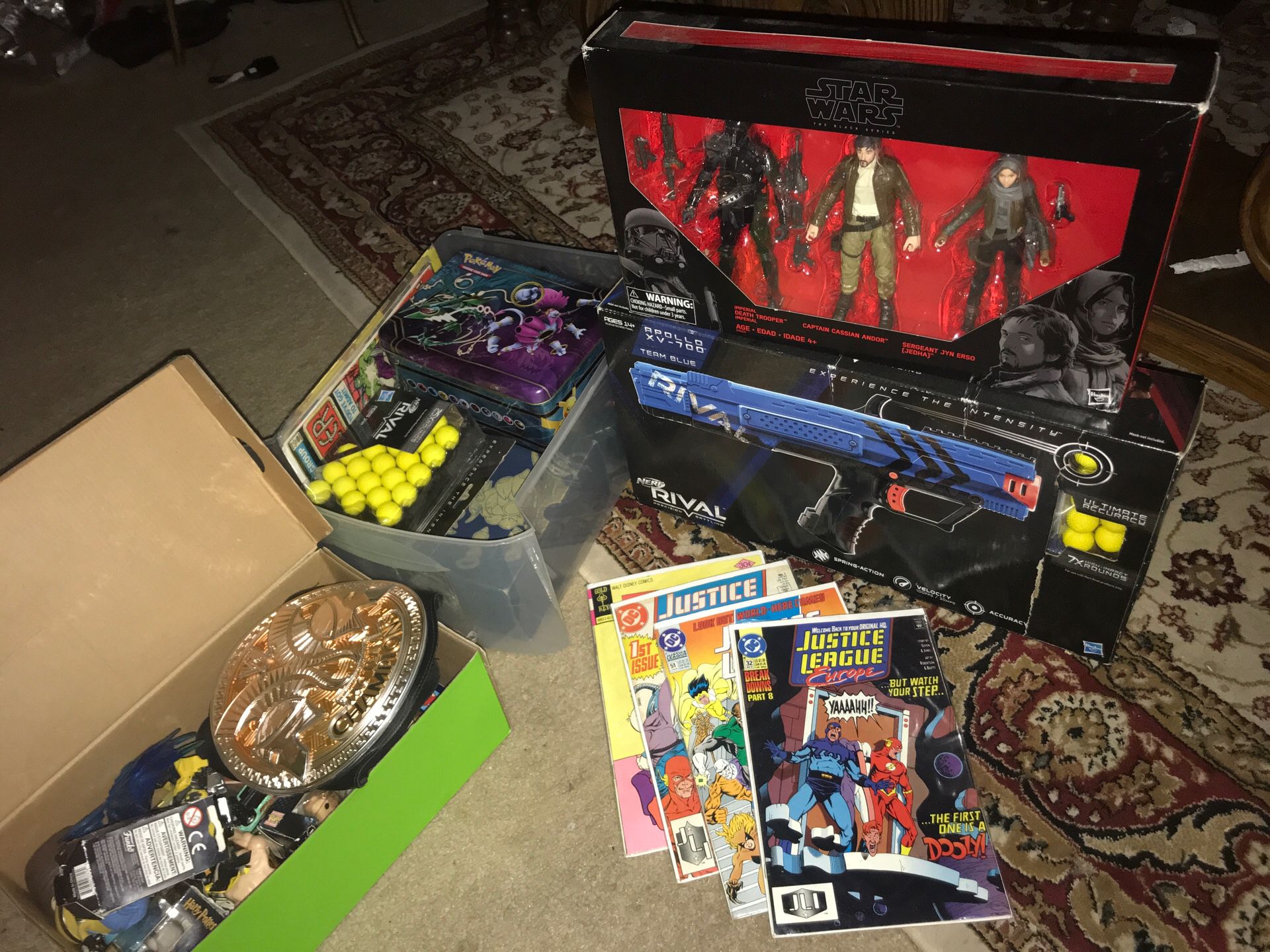 Box of toys and comics and Pokémon cards and pop figures and mini pop figures