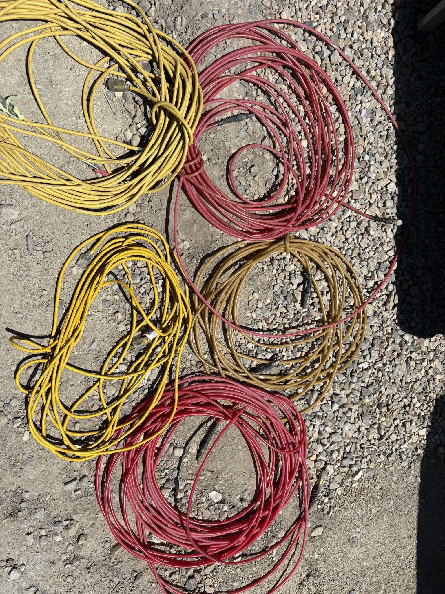 2 Extension Cords And 3 Air Hoses