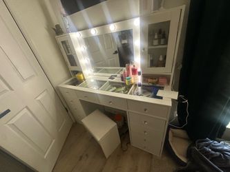 White makeup vanity with stool