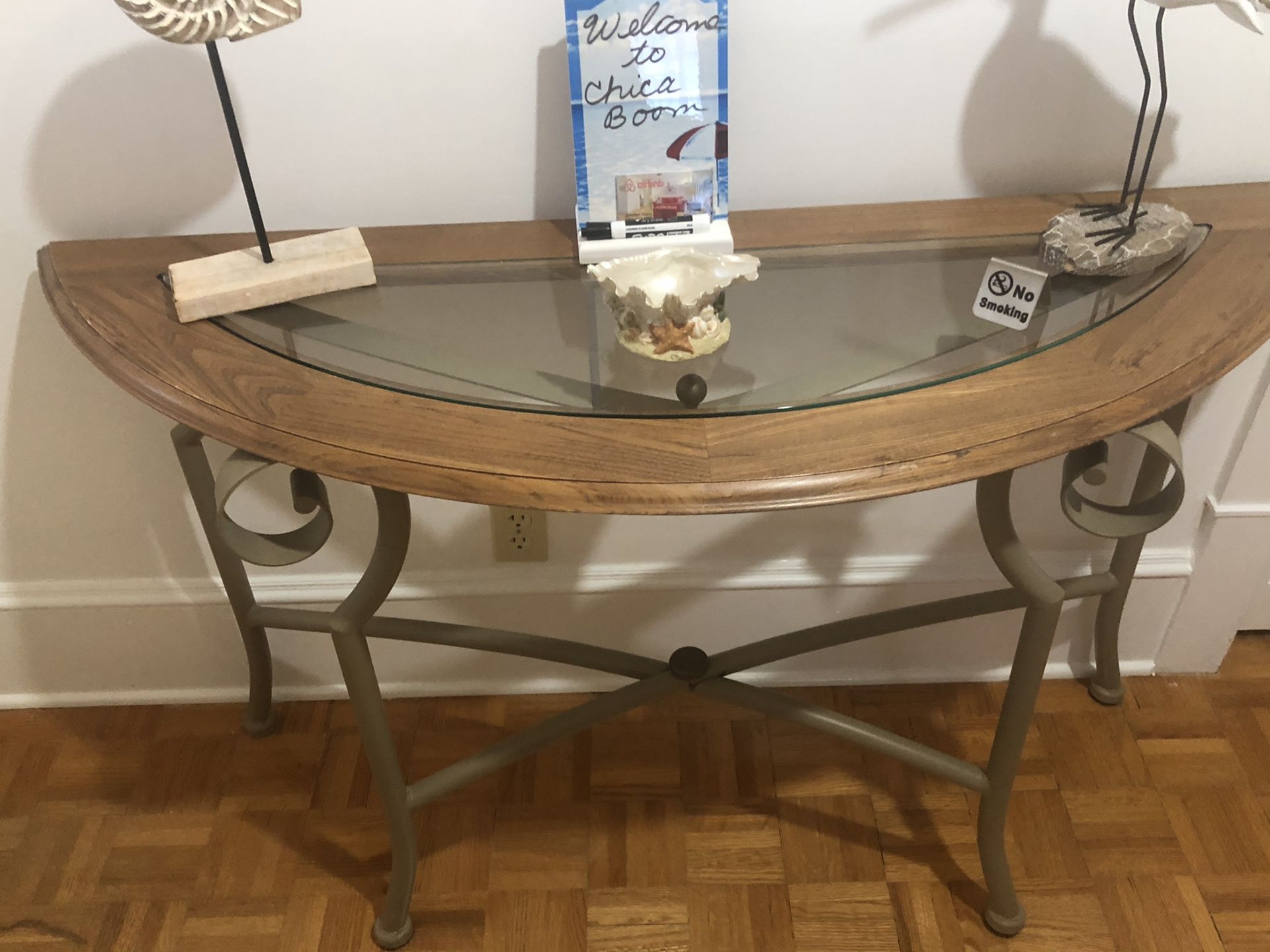 Half moon table with shelve over it. Shelve is good to hang hats, keys or umbrellas