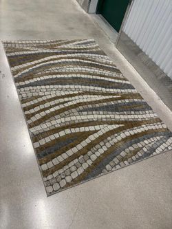 Gray , gold , beige rug .. 7 1/2 x 5 feet $50