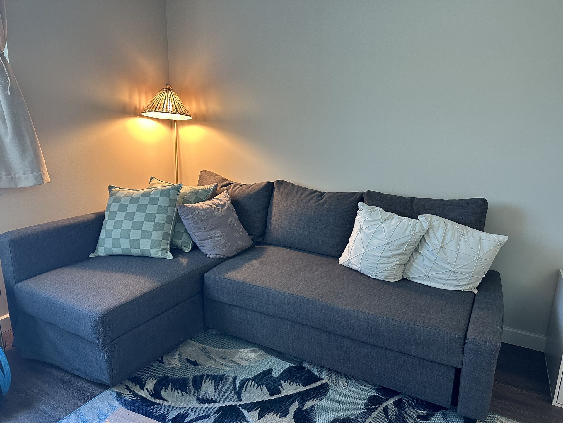 slightly worn blue couch