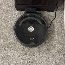 iRobot Roomba Robotic Vacuum with Dock  Price: $120 OBO