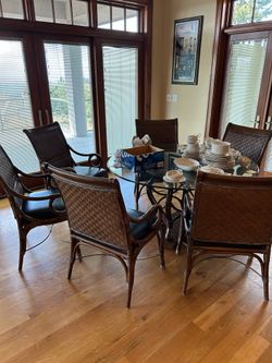 Hollywood Regency Glass and Metal And Rattan Table and 6 Chairs