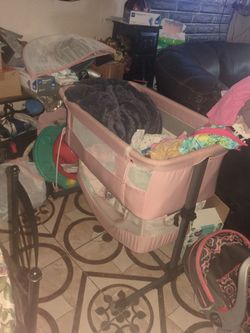 Pink baby bassinet