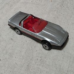 Zee Toys Diecast 1984 Chevrolet Corvette convertible in silver with a red interior. 