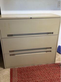 Lateral file cabinet. 3 drawer. Metal. 42” wide, 38.5” high, 18” deep.