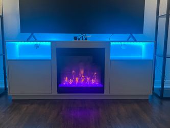 Entertainment center with built in fireplace