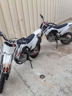 Two SSR 150cc motorsport dirt bikes