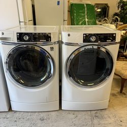 GE RightHeight Design front-load laundry pair featuring a washer and dryer with built-in risers