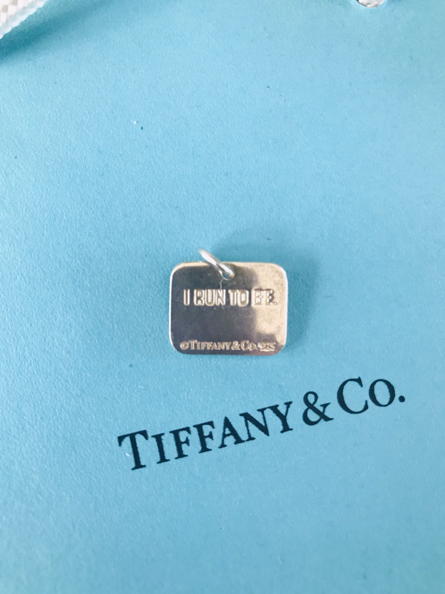 Tiffany and Co. women’s Nike marathon pendant sterling silver hallmark of coarse great condition please ask any questions thank you for looking