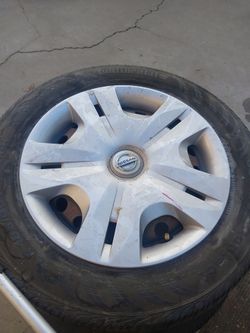 15 inch Nissan. Rim and tires