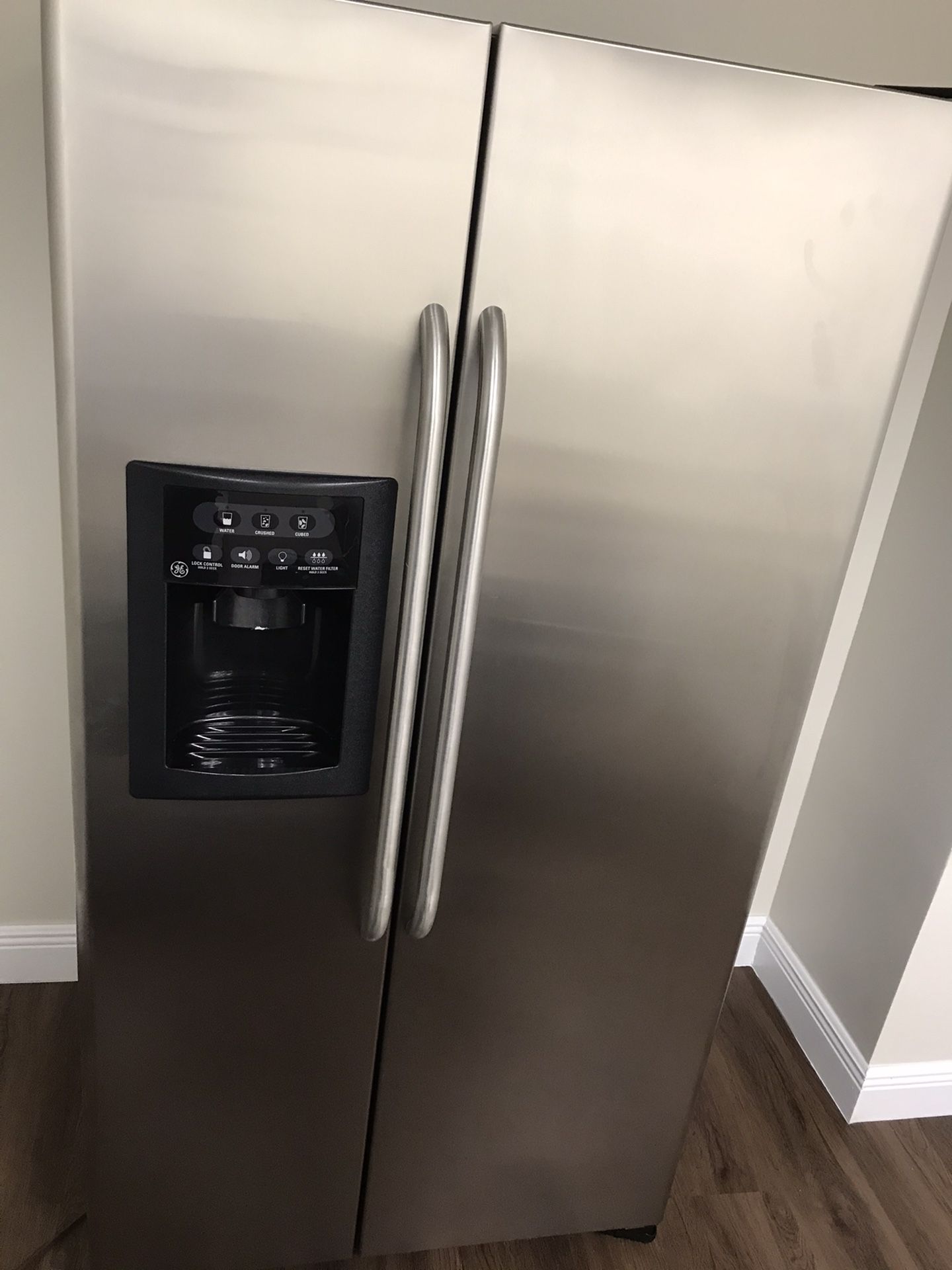 Used Stainless Steel GE side by side Refrigerator - Excellent shape
