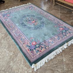 Oriental Rug And Square Glass Table