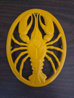 Yellow cast iron lobster trivet