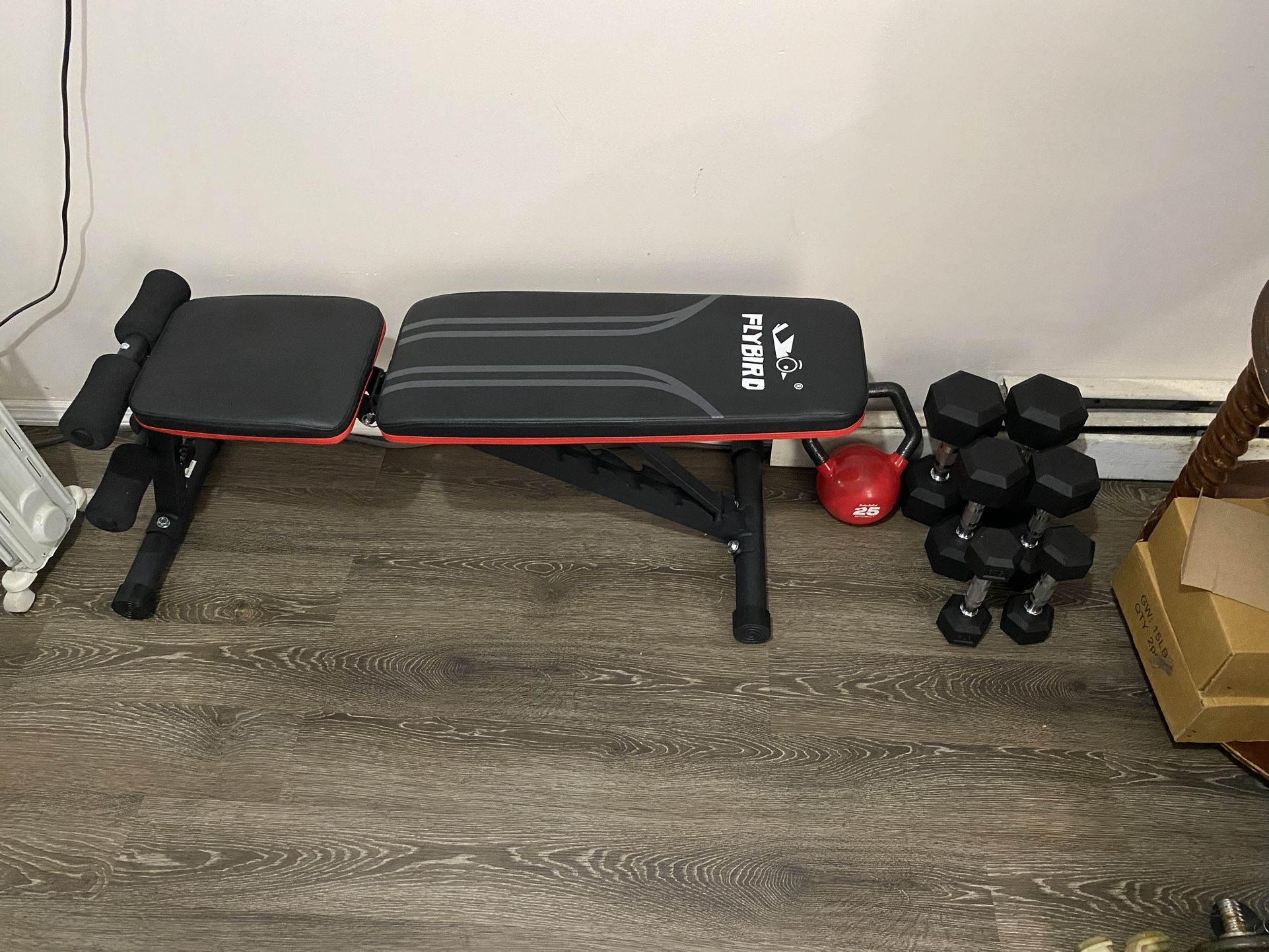 Fly Bird adjusting workout bench and weights