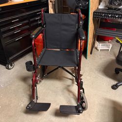 Transport Chair Wheelchair With Leg Extensions and Brakes. Folds.