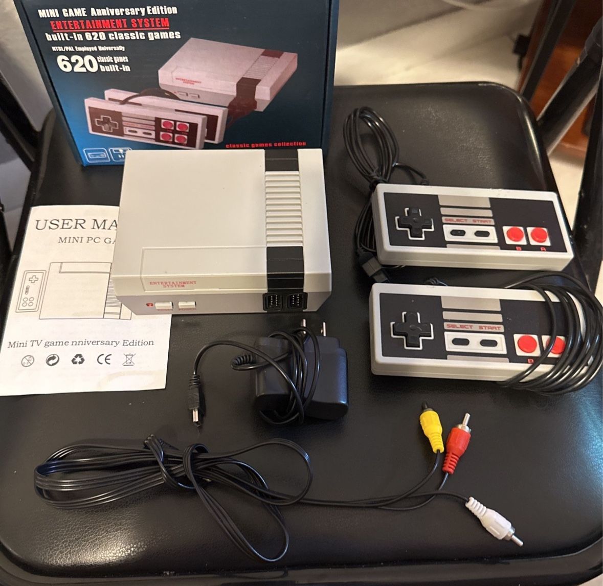 Mini Game Anniversary Edition Entertainment System," a retro-style console with 500 built-in classic games, similar to the NES Classic Edition. It inc