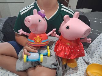 Peppa pig toys. Good Condition. 

- 12' Peppa Muddy Puddles party  interactive doll. 55 sounds and phrases   including a song and dance mode. 

- 11' 