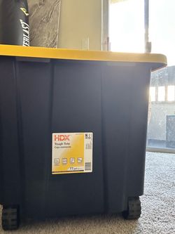 HDX 77 Gal. Tough Storage Tote with Wheels in Black with Yellow Lid Store SKU# 1010-579-935