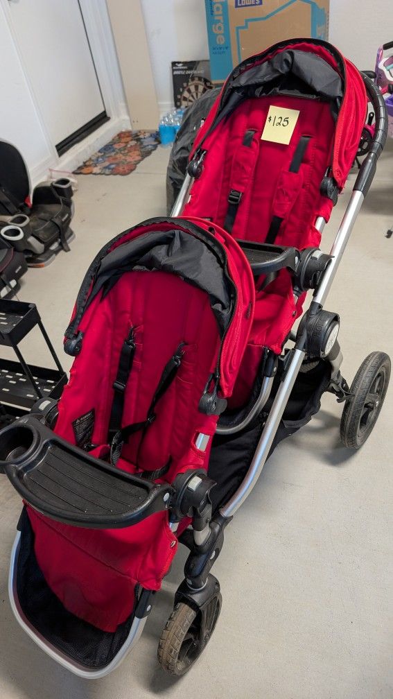 Red baby jogger city select double stroller