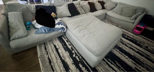 Four piece sectional with pillows
