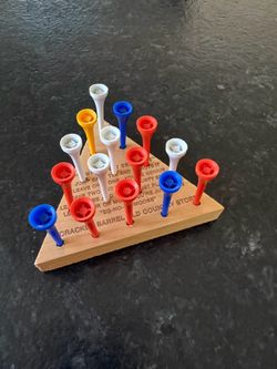 Triangle peg board game