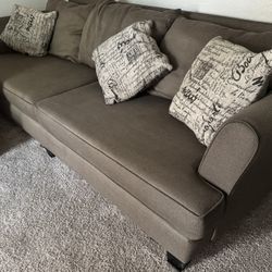 2 Couches & Ottoman With 7 Pillows 