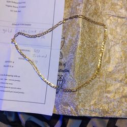 Brand New 10 Karat And Figaro Gold Chain