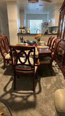 Dining set, includes table, sit, six chairs, comes with leaf to table and the hutch