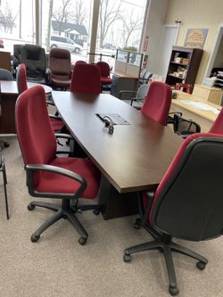 New boat shaped mocha color conference table with power and data ports