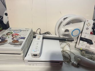 White Nintendo Wii system with games