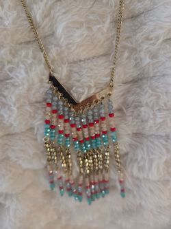 Gold tone necklace with turquoise colors