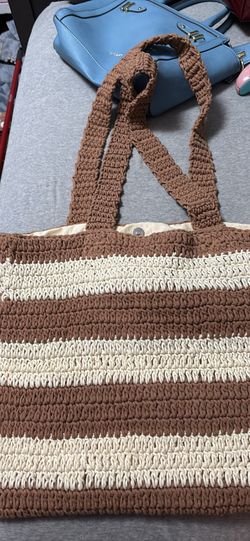Brown and white purse