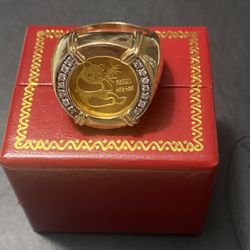 Collectible ring with 24 carat panda coin. The band is 10 carat, size 12. I paid 4500, asking for $2,000 firm price.