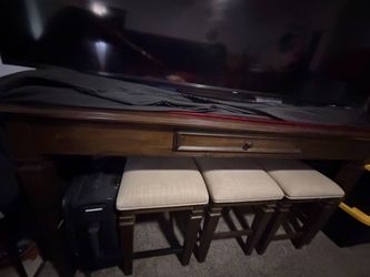 little wooden table with side stools