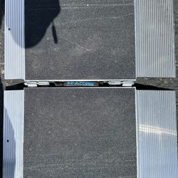 This image shows an EZ-ACCESS Suitcase Singlefold ramp with safety warnings, usage instructions, and a maximum load capacity of 800 lbs.