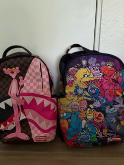 Pink Panther and Sesame Street backpacks spray ground